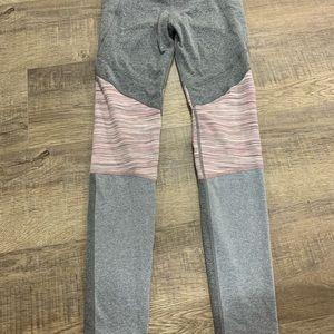 Dark gray, Pink and light gray athletic leggings.